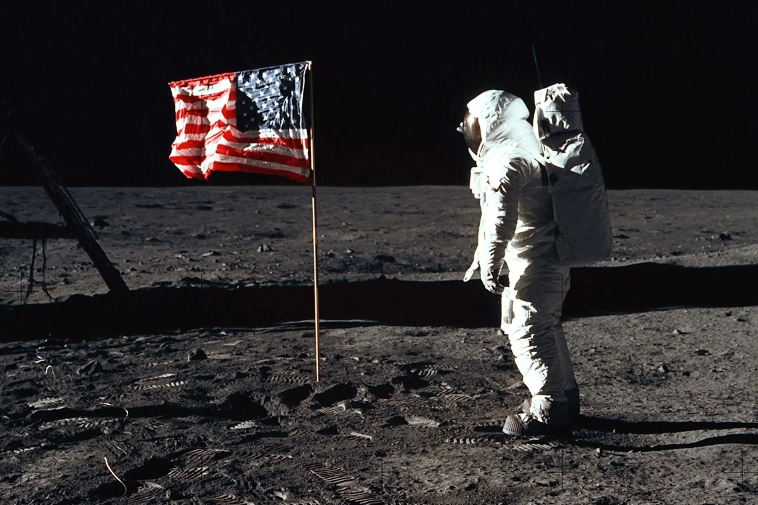 Exploring the Apollo 11 Moon Landing: Buzz Aldrin stands beside the lunar module 'Eagle,' with the barren lunar landscape stretching behind him.